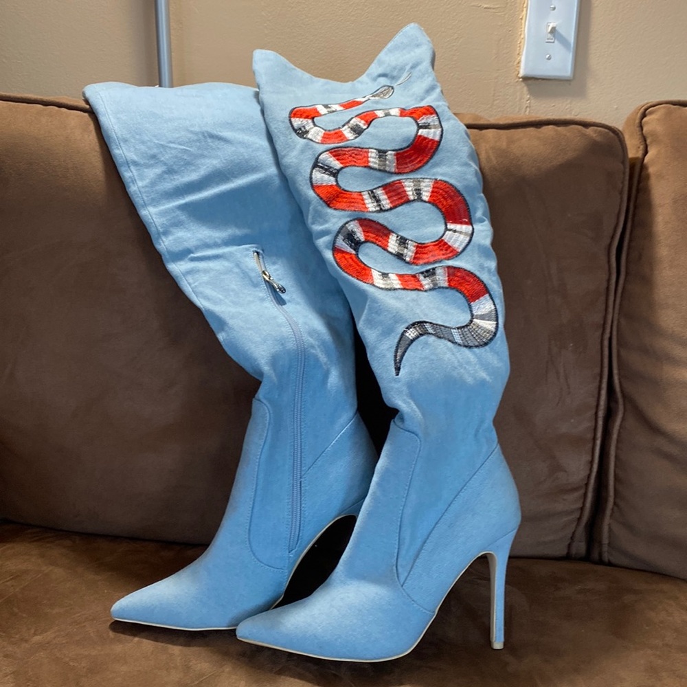 Thigh high Denim Boots, used once , light blue with snake embroidered .